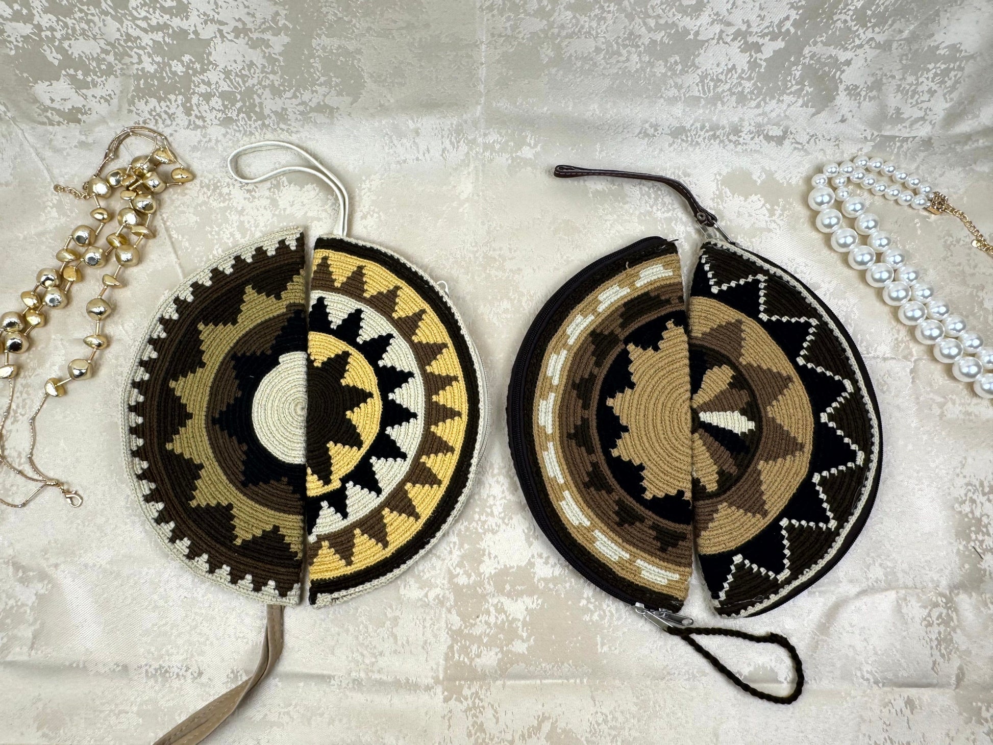 Two decorative circular items with geometric patterns on a textured surface.