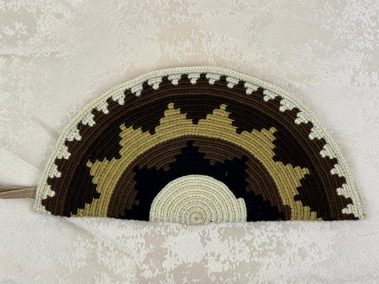 Crocheted rainbow pattern on a textured surface