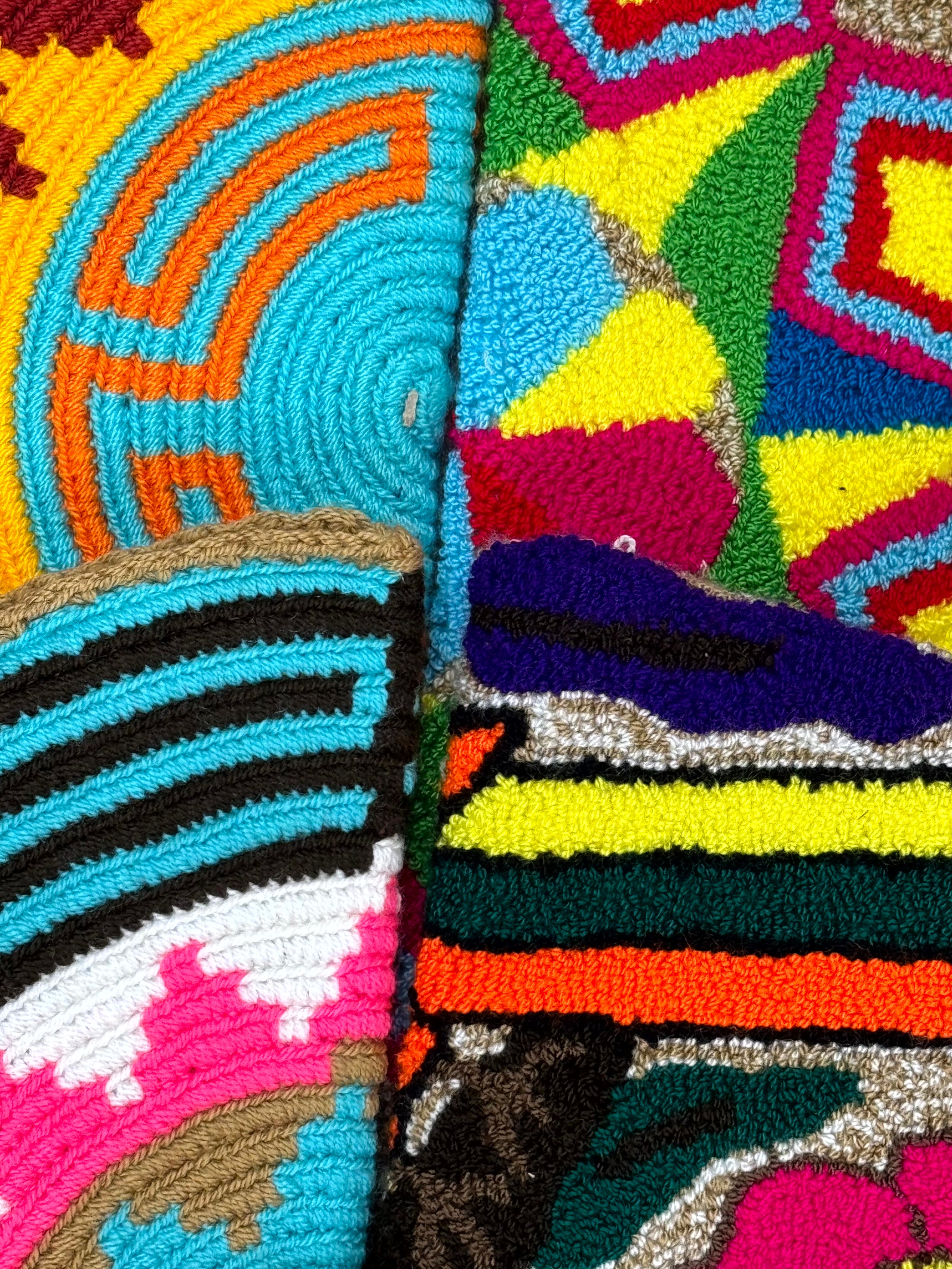 Close-up of a colorful woven textile with geometric patterns