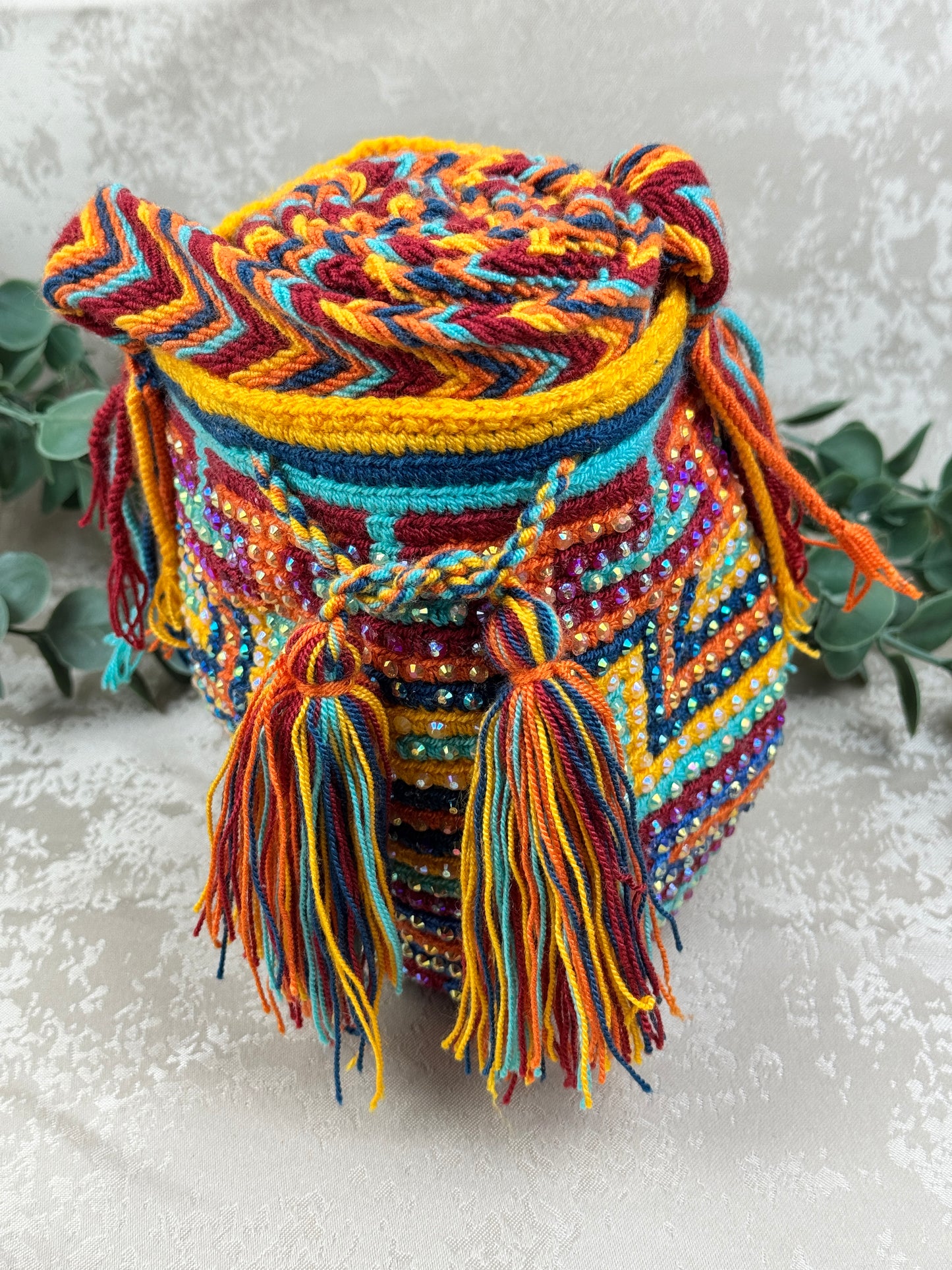 Correa tejida a mano de mochila Wayuu Susuchón edición brillante artesanal.